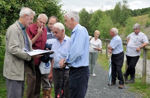 Dr. Ivor Brown (left) showing old plans to fellow walkers on the tour around the Granville Country Park.