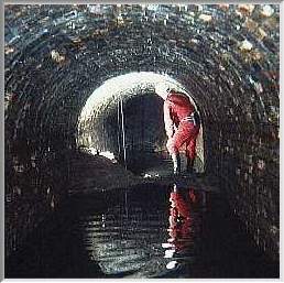Club member inside tunnel - under 'well' shaft
